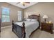 Comfortable bedroom with natural light, ceiling fan, and a classic wooden bed frame at 95 Vivante Blvd # 9524, Punta Gorda, FL 33950