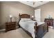 A spacious bedroom showcasing a wooden bed frame, side tables, and neutral wall color at 95 Vivante Blvd # 9524, Punta Gorda, FL 33950