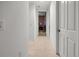Neutral hallway with white trim and doors, leading to other rooms of the home at 95 Vivante Blvd # 9524, Punta Gorda, FL 33950