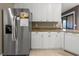 A kitchen featuring granite countertops, stainless steel refrigerator and dishwasher at 95 Vivante Blvd # 9524, Punta Gorda, FL 33950