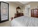 Large main bedroom showcases a dresser, closet, and access to a private balcony at 95 Vivante Blvd # 9524, Punta Gorda, FL 33950