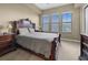 Spacious main bedroom featuring a large bed, three bright windows, and luxury furnishings at 95 Vivante Blvd # 204, Punta Gorda, FL 33950