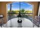 Enjoy outdoor living on this cozy patio with seating and views of lush greenery at 95 Vivante Blvd # 9524, Punta Gorda, FL 33950