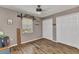 Comfortable bedroom offering wood-look floors, a ceiling fan, a window, and two closets for ample storage at 1372 Annette St, Punta Gorda, FL 33980