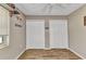 Well-lit bedroom with neutral walls, laminate floors, two closets, and a window to bring in plenty of natural light at 1372 Annette St, Punta Gorda, FL 33980