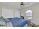 Comfortable bedroom with two closets, a large window, and a ceiling fan for added convenience at 1372 Annette St, Punta Gorda, FL 33980
