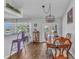 Inviting dining area with a breakfast bar, stylish table, and backyard view, perfect for gatherings at 1372 Annette St, Punta Gorda, FL 33980