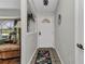 Inviting entryway with decorative tile flooring, a stylish front door, and a glimpse into the living area at 1372 Annette St, Punta Gorda, FL 33980