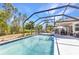 Enjoy this beautiful home's screened-in pool and patio for a tranquil outdoor experience at 1372 Annette St, Punta Gorda, FL 33980
