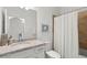 Bright bathroom featuring granite countertops, white cabinets, and a shower-tub combo with tile surround at 14061 Heritage Landing Blvd # 445, Punta Gorda, FL 33955