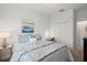 Comfortable bedroom with a boat-themed wall art piece, desk, and a closet for ample storage at 14061 Heritage Landing Blvd # 445, Punta Gorda, FL 33955
