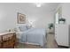 Cozy bedroom with a blue quilt, a desk, and a bright window at 14061 Heritage Landing Blvd # 445, Punta Gorda, FL 33955