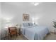 Bright bedroom featuring a cozy bed, a desk, and a decorative plant at 14061 Heritage Landing Blvd # 445, Punta Gorda, FL 33955