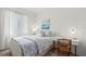 Bedroom with a desk, chair, and white bedding set at 14061 Heritage Landing Blvd # 445, Punta Gorda, FL 33955