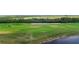 View of the manicured golf course with its lush green grass and well-placed sand traps at 14061 Heritage Landing Blvd # 445, Punta Gorda, FL 33955