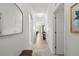 Inviting hallway with neutral tones, leading to the main living areas of the home at 14061 Heritage Landing Blvd # 445, Punta Gorda, FL 33955