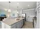Modern kitchen with granite countertops, stainless steel appliances, and open layout to the living area at 14061 Heritage Landing Blvd # 445, Punta Gorda, FL 33955