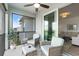 Relaxing screened patio with comfortable seating, table, and a view of the outdoor surroundings at 14061 Heritage Landing Blvd # 445, Punta Gorda, FL 33955