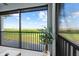 Screened patio offers a view of the expansive landscape, providing a seamless indoor-outdoor living experience at 14061 Heritage Landing Blvd # 445, Punta Gorda, FL 33955