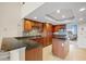 Gourmet kitchen featuring wooden cabinetry and a stylish island at 1410 Park Beach Cir # 113, Punta Gorda, FL 33950