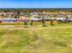 A home encircled on a lush green golf course with open space and mature trees in a desirable neighborhood at 142 Rotonda Cir, Rotonda West, FL 33947