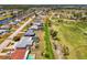 An aerial shot of homes along a golf course, many with pools, creating a scenic residential landscape at 142 Rotonda Cir, Rotonda West, FL 33947