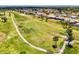 A picturesque view of a golf course bordered by homes, creating an ideal blend of recreation and residential living at 142 Rotonda Cir, Rotonda West, FL 33947