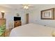 Bright bedroom with a king-size bed, closet, and a TV, offering a comfortable and relaxing space at 142 Rotonda Cir, Rotonda West, FL 33947