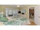 Spacious bedroom with patio access, a king-sized bed, and bright, natural lighting at 142 Rotonda Cir, Rotonda West, FL 33947