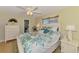 Comfortable bedroom offering bright natural light, a king-sized bed, and neutral colors at 142 Rotonda Cir, Rotonda West, FL 33947