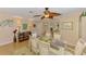 Inviting dining room with seating for six, laminate wood flooring, and light-colored walls at 142 Rotonda Cir, Rotonda West, FL 33947