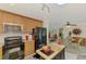 Well lit kitchen includes an island, wood cabinets and modern appliances at 142 Rotonda Cir, Rotonda West, FL 33947