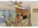 Open concept kitchen with stainless appliances and access to the pool area at 142 Rotonda Cir, Rotonda West, FL 33947