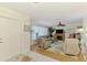 Bright living room with hardwood floors, a fireplace, and large windows, creating a comfortable and inviting space at 142 Rotonda Cir, Rotonda West, FL 33947