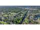 Wonderful aerial view of the community featuring lush trees, a canal, and community pool in a convenient location at 1515 Forrest Nelson Blvd # N101, Port Charlotte, FL 33952