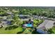 Beautiful aerial view of the Oak Forrest Condominiums community pool and manicured lawns at 1515 Forrest Nelson Blvd # N101, Port Charlotte, FL 33952