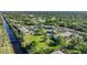 Aerial view of the Oak Forrest Condominiums featuring a community with a canal at 1515 Forrest Nelson Blvd # N101, Port Charlotte, FL 33952