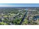 Community N101 aerial view featuring mature trees, river, and well-maintained condo buildings at 1515 Forrest Nelson Blvd # N101, Port Charlotte, FL 33952
