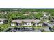 Aerial view showcasing the community buildings, parking, and mature landscaping at 1515 Forrest Nelson Blvd # N101, Port Charlotte, FL 33952