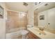 Bathroom showcasing a single vanity and step in shower with sliding door at 1515 Forrest Nelson Blvd # N101, Port Charlotte, FL 33952