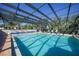 Enclosed community pool with ample seating, offering a refreshing retreat with clear blue water at 1515 Forrest Nelson Blvd # N101, Port Charlotte, FL 33952