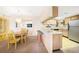 The dining area leads into the kitchen with a breakfast bar for seating at 1515 Forrest Nelson Blvd # N101, Port Charlotte, FL 33952