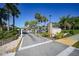 Community gated entrance with lush landscaping and signage for Oak Forest, providing security at 1515 Forrest Nelson Blvd # N101, Port Charlotte, FL 33952