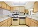 Efficient kitchen with ample counter space and light wood cabinets at 1515 Forrest Nelson Blvd # N101, Port Charlotte, FL 33952
