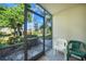 Enclosed lanai featuring views of the well-manicured community landscaping at 1515 Forrest Nelson Blvd # N101, Port Charlotte, FL 33952