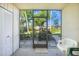 Enclosed lanai showcasing views of the green yard and lush landscaping at 1515 Forrest Nelson Blvd # N101, Port Charlotte, FL 33952