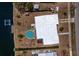Aerial view of a waterfront property with pool, private dock, and boat lift at 159 Godfrey Ne Ave, Port Charlotte, FL 33952