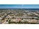 Expansive aerial view showcasing a waterfront neighborhood, featuring canal access and proximity to open water at 159 Godfrey Ne Ave, Port Charlotte, FL 33952