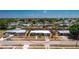 An aerial view showcasing a single-story home in a neighborhood with canals behind the property at 159 Godfrey Ne Ave, Port Charlotte, FL 33952