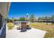 Private backyard patio with table and umbrella, showcasing canal views and an above-ground pool at 159 Godfrey Ne Ave, Port Charlotte, FL 33952
